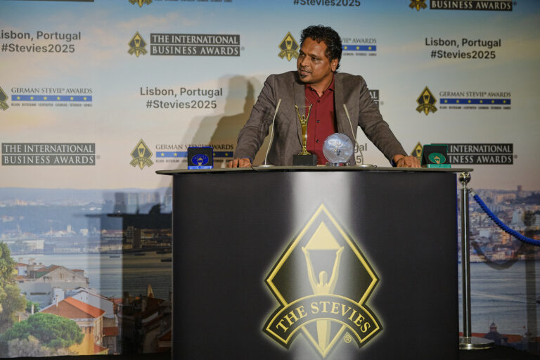 Chirag Patel Head of Europe Hidden Brains holding Stevie Award trophy Lisbon Portugal 2025